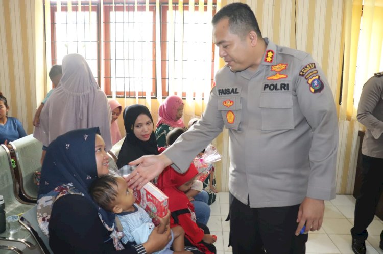 Kapolres Langkat Beri Bantuan Makanan Tambahan Kepada Anak